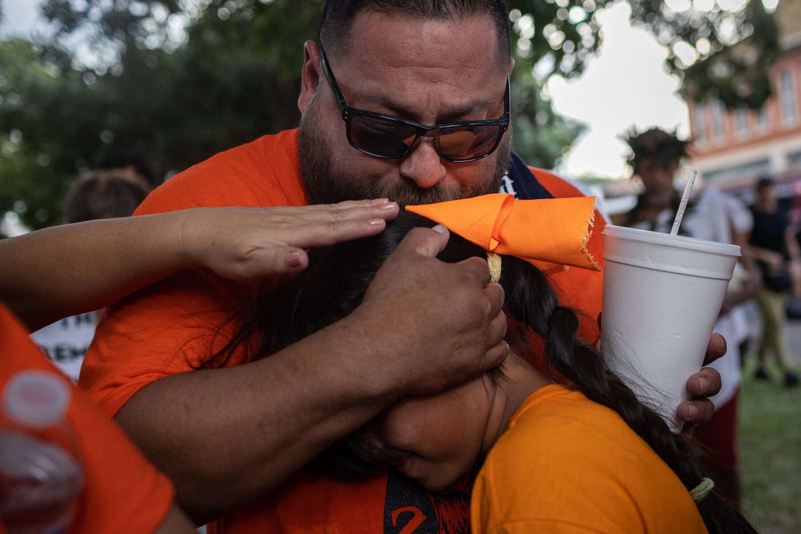 Javier Cazares hugged Caitlyne Gonzales, 10, after she spoke at a rally organized by Mr. Cazares to demand accountability and policy reform in response to the shooting.